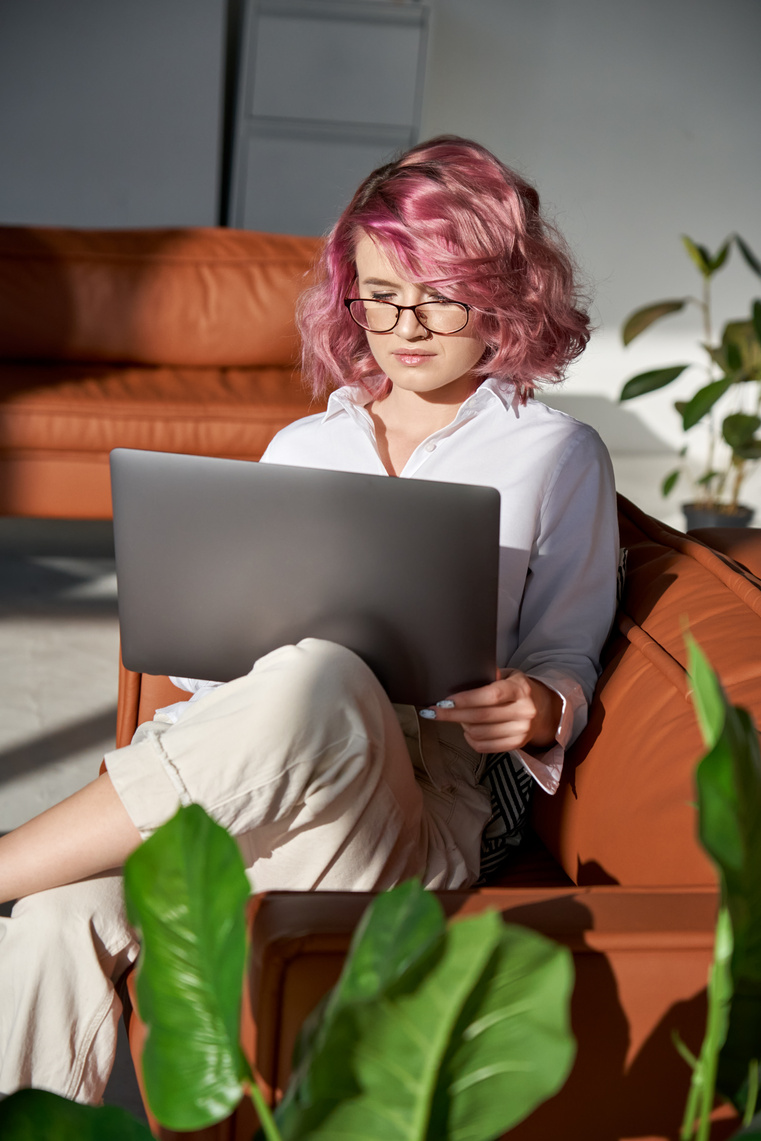 Young Woman  Using Laptop at Home 